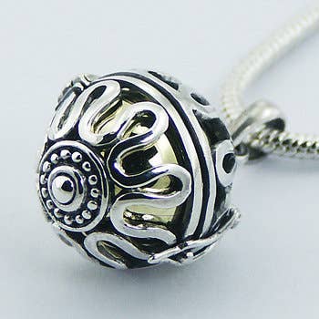 Intricate Harmony ball pendant in sterling silver